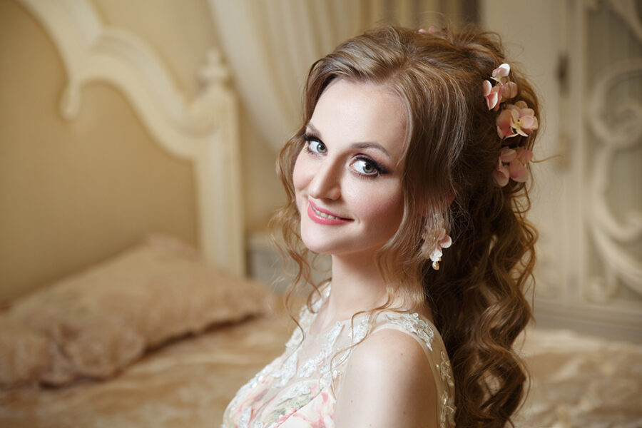 Portrait of a happy smiling bride in an interior.