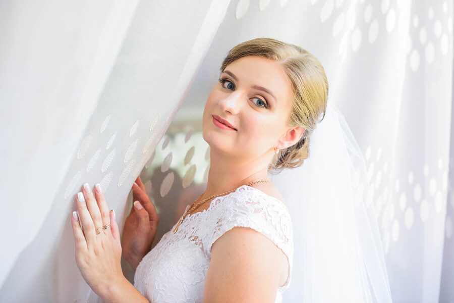 Beautiful bride portrait with veil over her face. portrait of young gorgeous bride. Wedding.