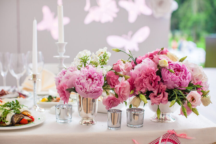 Beautiful bright bouquet of flowers on the wedding table in vase